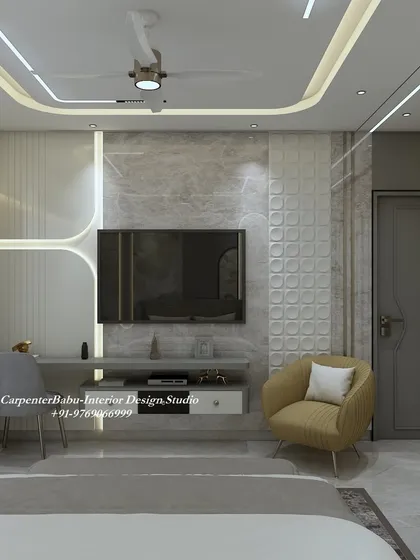 The TV unit in this bedroom is simple and elegant, with a floating console and a textured back panel. The design is minimalist and functional.