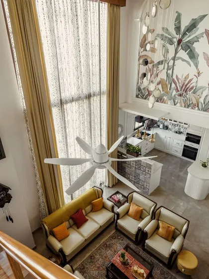 An overhead view of the living room from image 123, highlighting the open layout and double-height space.