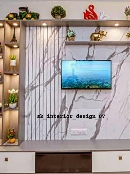 A decorative TV unit combining a marble-finish panel with fluted textures. The illuminated corner shelving is perfect for displaying artifacts and personal treasures.
