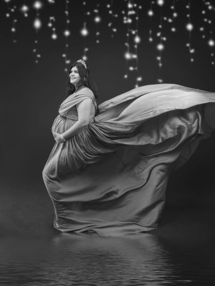 A black and white version of our regal, golden-hued portrait. The monochrome edit adds a different layer of drama and timelessness to the scene.