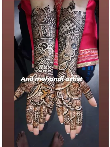 An intricate design filled with classic mehandi elements. This pattern includes paisleys, florals, and checkerboard fillers, creating a dense and beautiful look on both hands.
