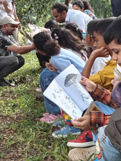 Learning in nature is a hands-on adventure. Here, our young naturalists and their parents become detectives, using identification charts to learn about the fascinating world of fungi during a mushroom foraging walk. It's education that feels like exploration.