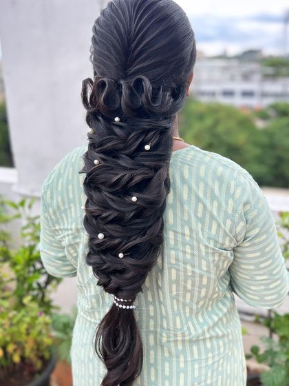 A close up from a different angle, highlighting the clean lines and loops of this advanced braid.