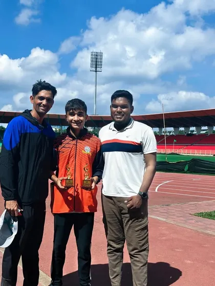 Yuv Vora with his coaches after his triumph at the nationals. This picture represents the strong bond between athlete and coach, which is fundamental to achieving success.