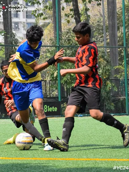 A tough tackle in the midfield. Our players are taught to be strong and determined in every challenge.