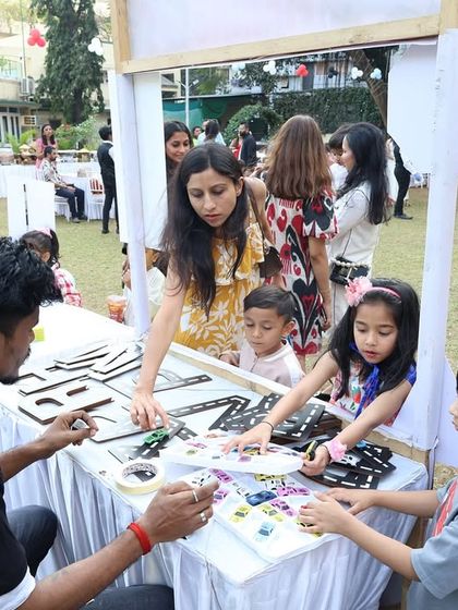 Guests of all ages enjoy the craft station, decorating their own car-themed items. It's a great way for parents and kids to have fun together.
