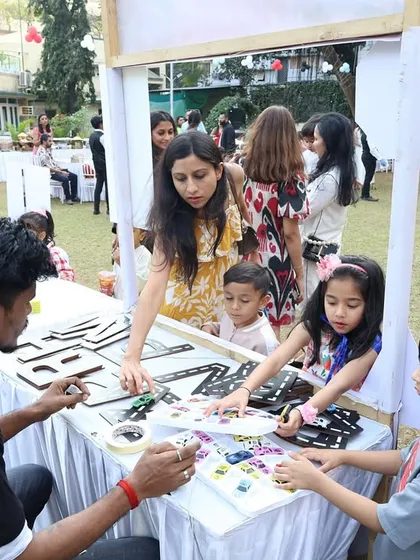 Guests of all ages enjoy the craft station, decorating their own car-themed items. It's a great way for parents and kids to have fun together.