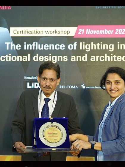 A speaker is presented with a token of appreciation after a successful session. Our workshops are a collaborative effort, and we celebrate the experts who make them possible.