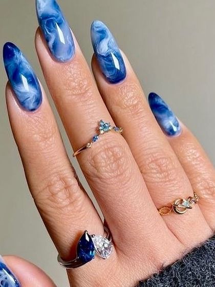 This set is inspired by the deep blue hues of a lapis lazuli stone. The rich blue and white marble effect is mesmerizing, giving the nails a look of natural, polished stone.