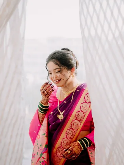 A moment of pure happiness captured. The bride's natural makeup lets her joy be the focus.