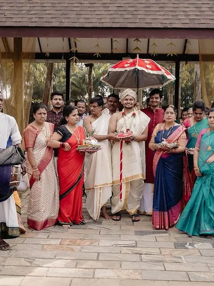 The groom's procession during the Kashi Yatra ritual, accompanied by family and traditional Nadaswaram players. It's a beautiful blend of solemn tradition and family celebration.