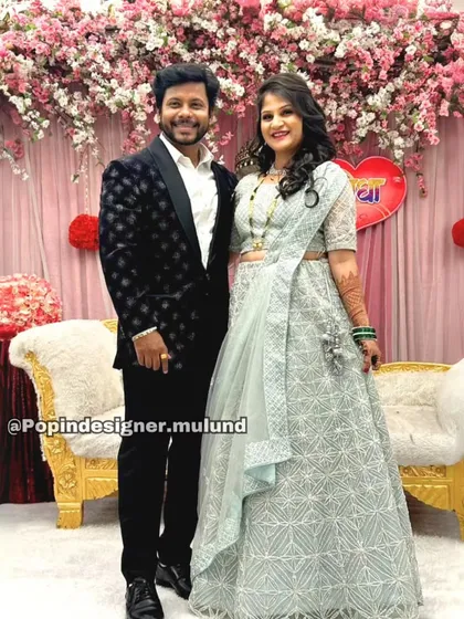 Another wonderful client couple celebrating in style. Her light blue embroidered lehenga-style gown and his black tuxedo are a perfect match, both rented from my collection.