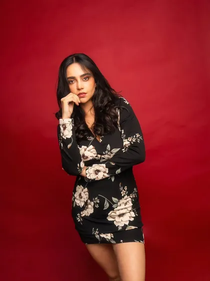 The bold red background creates a powerful, high-energy vibe. This kind of shot is perfect for making a strong statement in a portfolio.