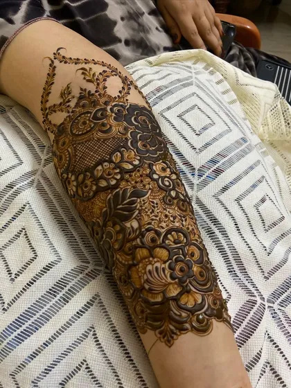 The complete forearm design, showing the beautiful cuff that transitions from the wrist. This is a popular choice for engagement and bridal henna.
