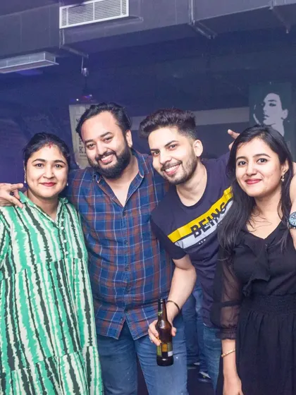 A group of friends enjoying drinks and good company.