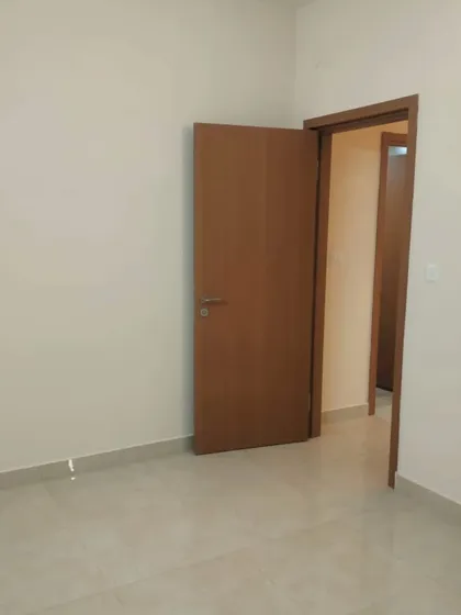 A bedroom with freshly painted walls and clean door frames. We ensure a neat finish around all fixtures and woodwork for a truly professional look. This neutral palette provides a perfect blank canvas for any decor style.
