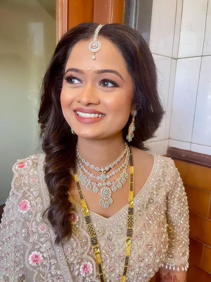 A beautiful candid shot of the bride, her makeup looking perfect from every angle.
