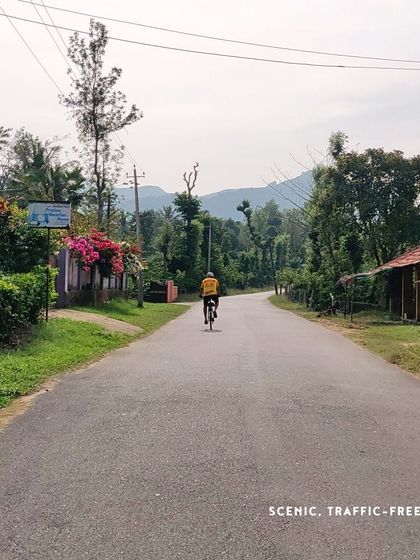 The idyllic village roads of South Coorg, with hills in the distance.