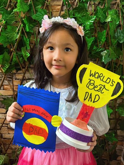 Getting ready for Father's Day with handmade gifts from the heart. This student created a "World's Best Dad" trophy and a personalized card.