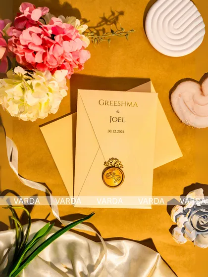 Simplicity meets elegance in this wedding invitation featuring a custom wax seal with interlocking rings. The minimalist design on high-quality cream cardstock is a timeless choice for a classic and refined celebration.