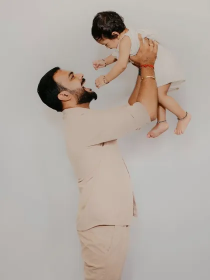 The pure joy between a father and his child. This simple, emotional portrait focuses on the connection and happiness, creating a memory that will be cherished forever.