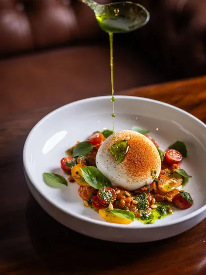 A perfect ball of creamy burrata sits atop a bed of sweet cherry tomatoes and fresh basil, finished with a drizzle of pesto. This Burrata Salad is a simple, beautiful start to a meal, proving that the best flavours often need the least fuss.