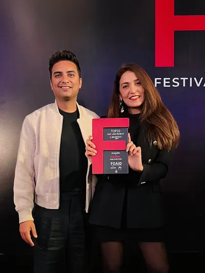 Posing with our FOAID award. This recognition, based on public appreciation, means the world to us. It’s a reminder from the universe to keep creating and sharing our passion.