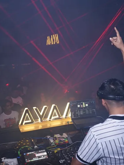A view from behind, showing the lasers and the crowd at my Goa debut.