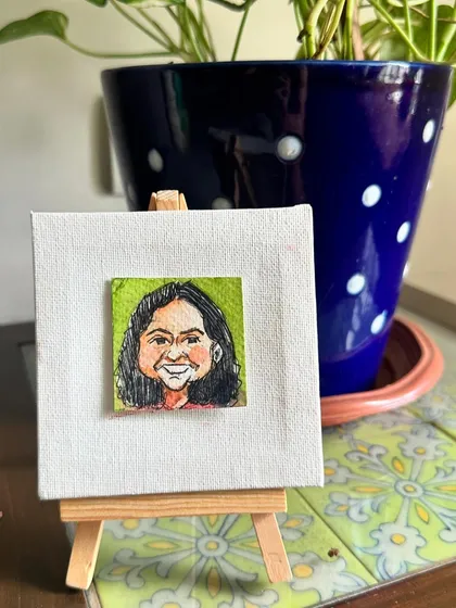 My mini portrait of Nithya on a small easel.