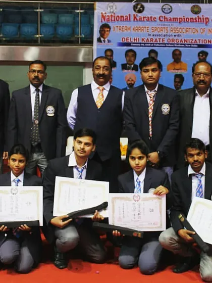 Our team proudly displaying their black belt certificates after a national championship in 2015. A black belt is a milestone, but the journey is the real reward.