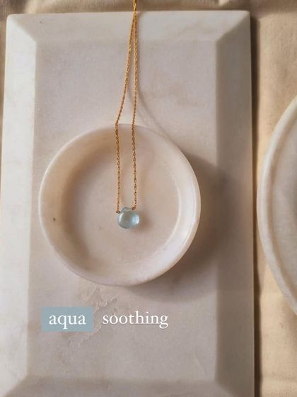 Another view of the Aquamarine heart drop pendant, a piece I designed for its soothing and calming properties.