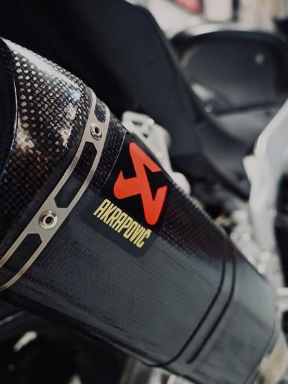 The carbon fiber Akrapovič exhaust on the Aprilia RSV4, providing a deep sound and more power.