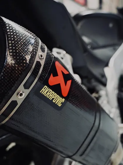 The carbon fiber Akrapovič exhaust on the Aprilia RSV4, providing a deep sound and more power.