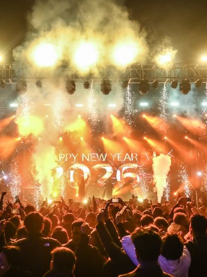 The countdown moment. Fireworks and smoke erupt as we ring in the New Year on stage, a truly explosive and joyous celebration.