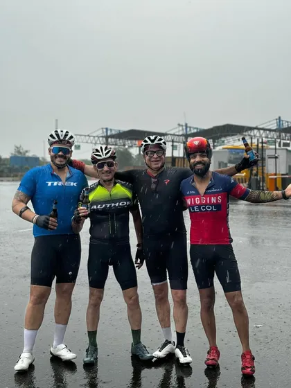 A group of friends celebrating a birthday together, rain or shine.