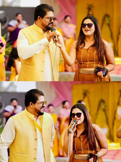 Sharing a mic and a laugh with a guest at a Haldi event. My approach is always interactive, making sure guests feel like they are part of the show, not just watching it.