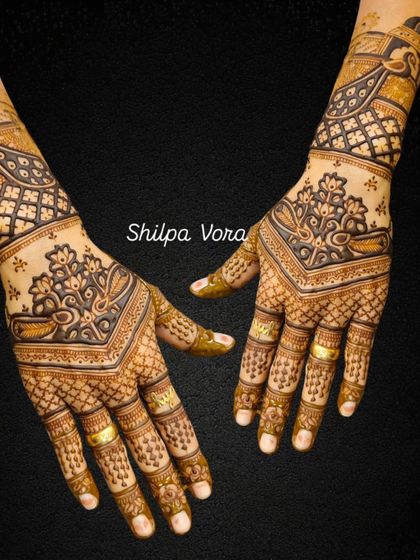 The same V-shaped design against a black background, making the intricate patterns stand out.