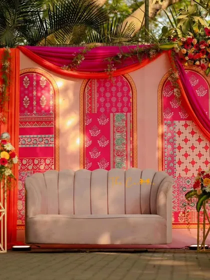 A Mehendi ceremony should be full of joy and color. We designed this vibrant backdrop using traditional block prints in bold pinks and oranges, creating the perfect setting for celebration.