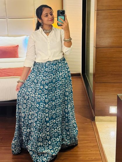 A modern take on Navratri wear. This client paired a simple white shirt with a beautiful printed skirt from my collection.
