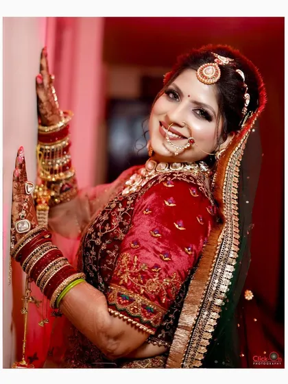 A classic bridal portrait showcasing the bride's joyful smile and intricate wedding attire. We focus on capturing the happiness and radiance of the bride on her wedding day with clean, vibrant photography.