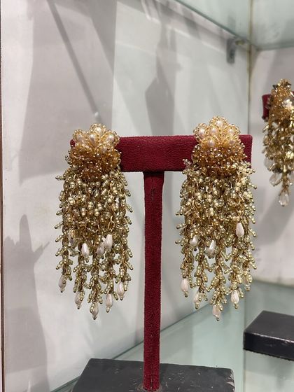 Our classic gold and pearl danglers are a bestseller for a reason. They are timeless and add a touch of royalty to any look.