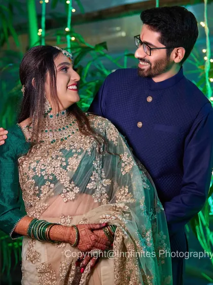 A candid photo of a couple sharing a smile, with soft green lighting creating a magical atmosphere. I use creative lighting to enhance the mood of your evening event.