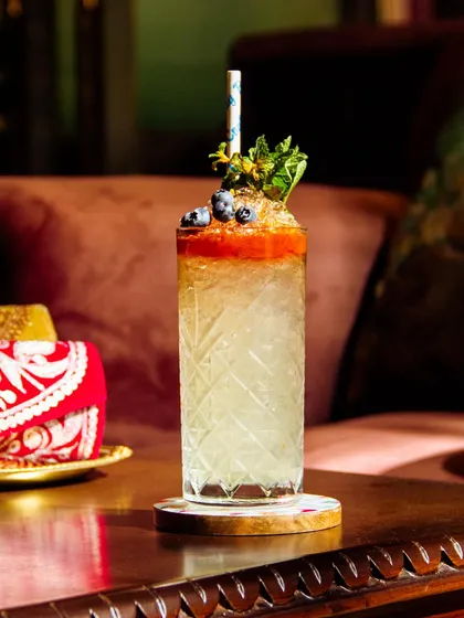 Quench your thirst with this delicious summer sip. A tall, refreshing cooler topped with fresh blueberries and mint, it's the perfect way to beat the heat in style.