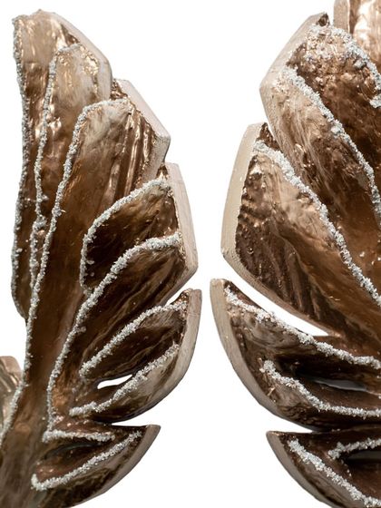 The detailed wing tips of "The Eternal Flight." This piece rises from the earth yet never forgets where it began, a tribute to growth and heritage.