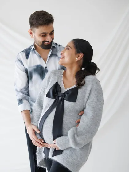A happy and relaxed couple's portrait, showcasing their genuine smiles and the easy comfort they share.