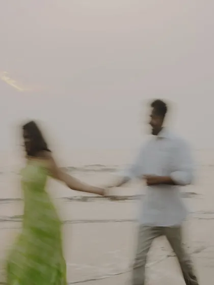 A dreamy, motion-blur photograph capturing the feeling of being swept away by love. This artistic shot from a beach pre-wedding session adds a touch of abstract beauty to your gallery.
