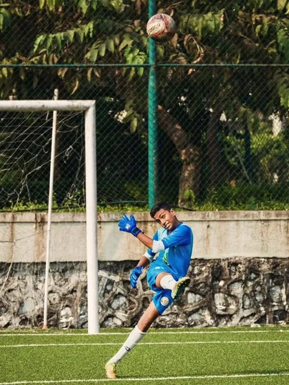 Our goalkeeper makes a powerful clearance during the U13 quarterfinal of the Thane Youth League.