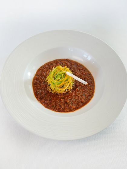 Where south meets soul. This is our Chettinad chicken keema, a richly spiced minced chicken dish served with bright lemon seviyan and crunchy sago puffs for texture.