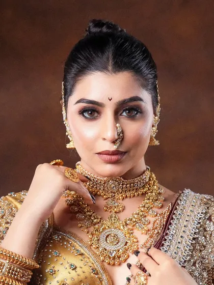 A close-up on tradition. This shot focuses on the stunning detail of bridal jewelry and the flawless makeup. My goal is to capture the richness and artistry of each piece, making it the hero of the image.