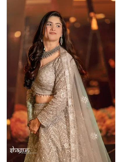 A portrait of pure elegance. The bride looks away from the camera, giving the shot a candid and timeless feel.